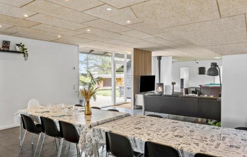 a dining room with a table and chairs at Beautiful Home In Snedsted With Sauna in Snedsted