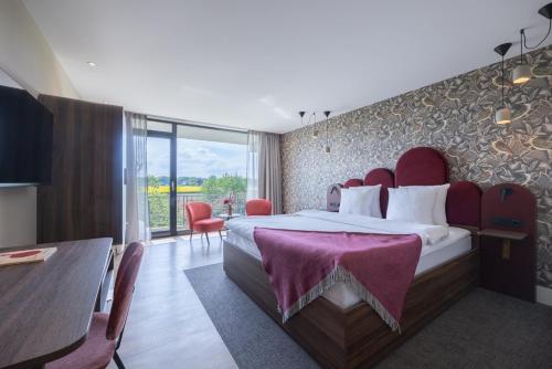 Postel nebo postele na pokoji v ubytování Van der Valk Hotel Melle - Osnabrück