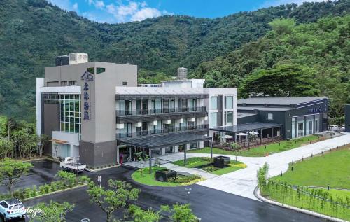 an aerial view of a hotel with mountains in the background at Izumi Boutique Hotel in Puli