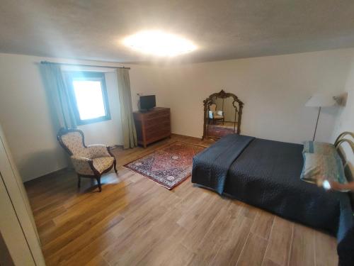 a bedroom with a bed and a dresser and a mirror at Appartamento la vista 2 CIR 0110 in Aosta