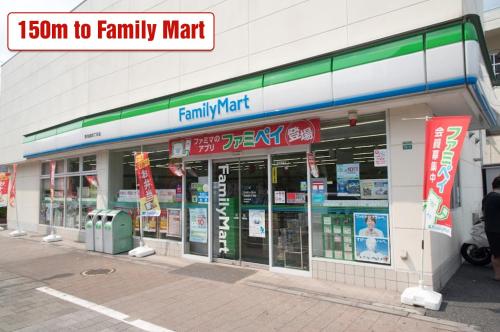 a store front of a family mart on a street at Ikebukuro Area 45 NishiikeApartment in Tokyo