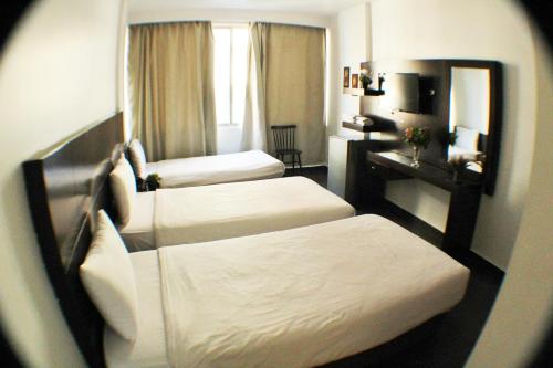 Katil atau katil-katil dalam bilik di Le Marly Hotel