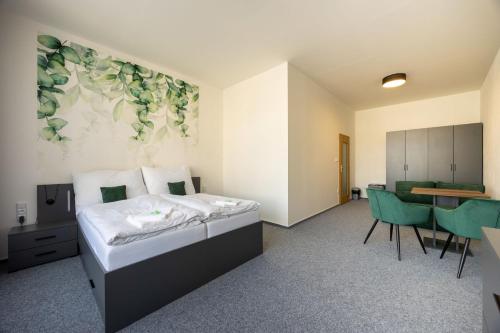 Postel nebo postele na pokoji v ubytování Hotel THT