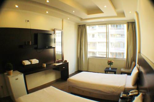 Katil atau katil-katil dalam bilik di Le Marly Hotel