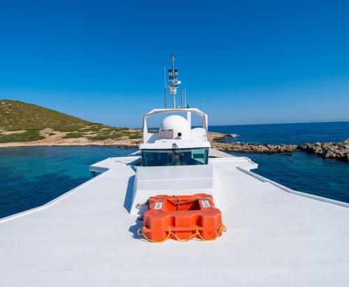 a boat with a red car on the front at Yalikavak Matilda Mega Yacth Hotel in Bodrum City