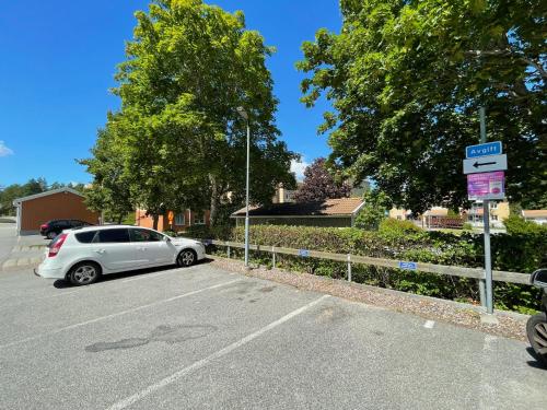a white car parked in a parking lot at Apartment in Sävja with Modern Amenities in Uppsala