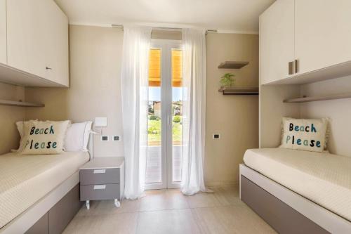 Postel nebo postele na pokoji v ubytování Seaside Home - Dove il mare di Villasimius diventa casa