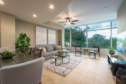 a living room with a couch and a table at Stunning & Luxurious 2Bed 2Bath Open floor plan in Orlando