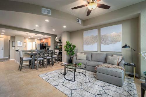 a living room with a couch and a table at Stunning & Luxurious 2Bed 2Bath Open floor plan in Orlando