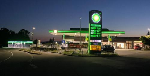 a gas station with a sign in front of it at Studio Apartments St. Martin in Erdmannsdorf
