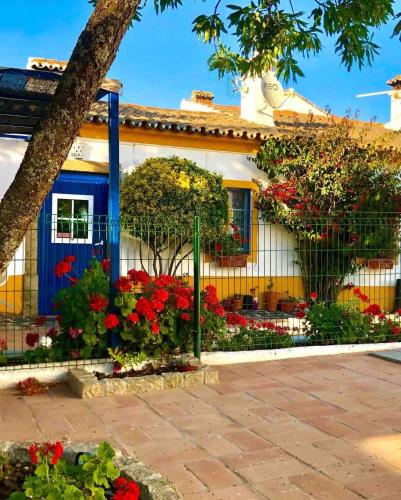 a house with flowers in front of it at Herdade das Coutadas by Portus Alacer in Portalegre