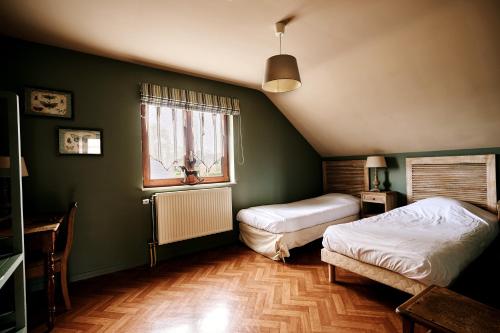 Postel nebo postele na pokoji v ubytování Gîte des Crêtes