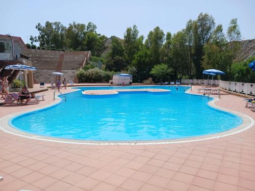 a large swimming pool with blue water at Grenilù Sea in Crotone