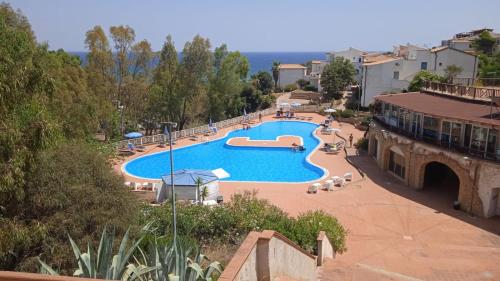 a large swimming pool in a resort at Grenilù Sea in Crotone