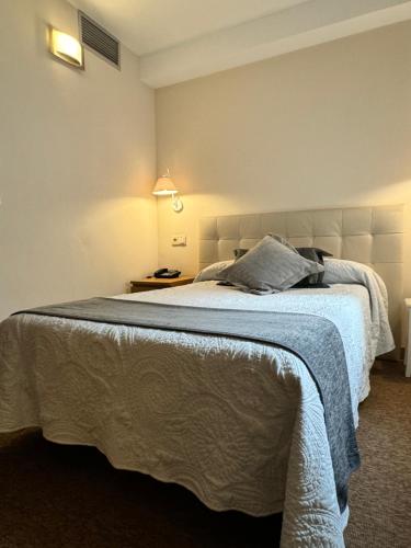 Ein Bett oder Betten in einem Zimmer der Unterkunft Nest Style Santiago