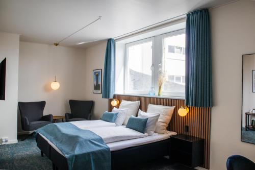 Postel nebo postele na pokoji v ubytování Hotel Phønix Hjørring