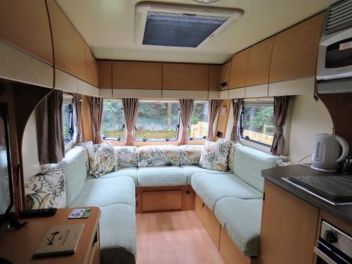 a couch in the back of a camper van at Billie in Hope