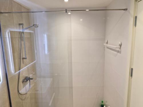 a shower with a glass door in a bathroom at Belgrade Waterfront BW Sava Aqua in Sajmište