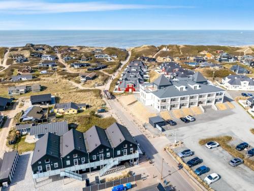 an aerial view of a small town next to the ocean at Lovely Holiday Apartment With A Large Balcony Facing The Dunes - 1020 in Ringkøbing