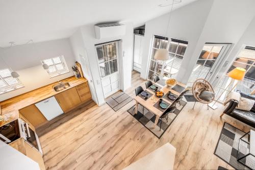 an aerial view of a kitchen and living room of a apartment at Lovely Spa House - 1006 in Hvide Sande