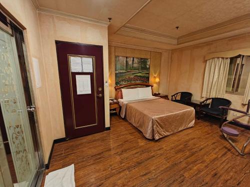 Tou Yuan Motelにあるベッド