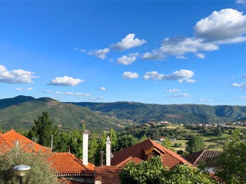 a view of a town with mountains in the background at Vinhais Hotel in Vinhais