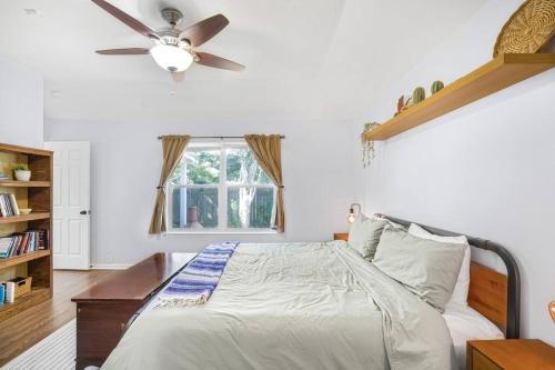 a bedroom with a bed with a ceiling fan at Spacious Cozy Home w Gym & Pool, Kid Friendly in Pflugerville