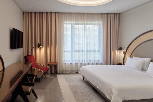 Postel nebo postele na pokoji v ubytování Neringa Hotel