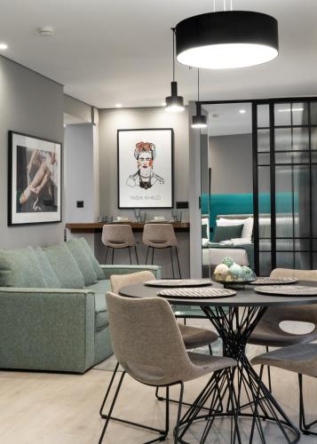 a living room with a couch and a table at Evripidou Suites in Athens