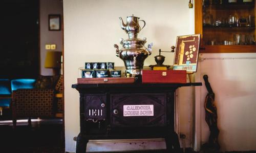 a table with a trophy on top of it at New Helvetia Historic Hotel in Platres