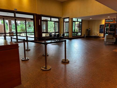 a large room with a table in the middle of it at Vista Azul Apart Hotel - Com Cozinha Compacta in Pedra Azul