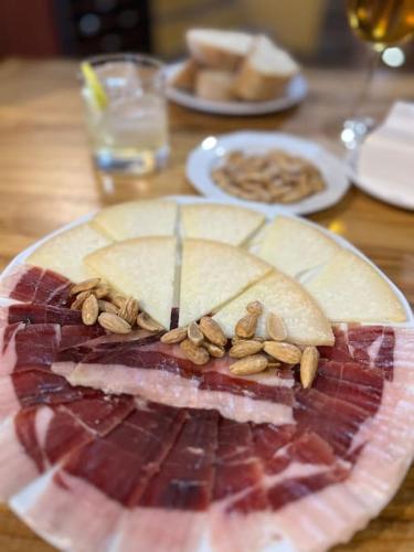 a plate of food with meat and nuts on it at Casa Andalucía - 3,5 Zimmer Haus unter den Sternen, Vivienda Rural VTARAL01059 in Sorbas