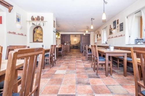 a dining room with wooden tables and chairs at Hotel Alte Post in Siegsdorf
