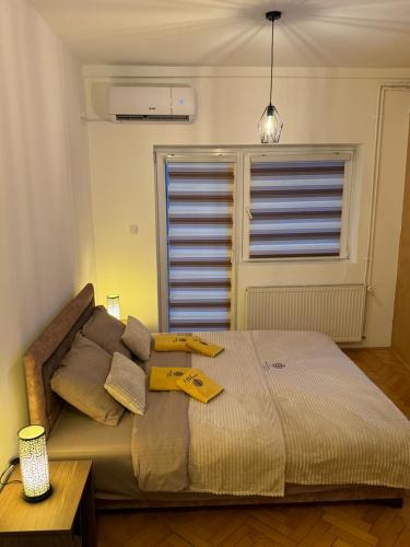 Postel nebo postele na pokoji v ubytování Loli apartman 2