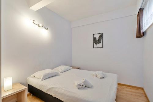 Postel nebo postele na pokoji v ubytování Ambassador Suites Leuven