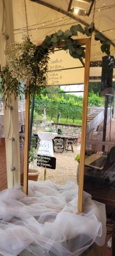 a bed in a tent with a table in the background at Wine & Art Relais Vallombrosa in Castelrotto