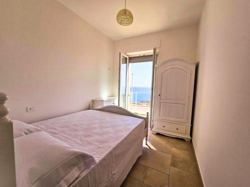 Postel nebo postele na pokoji v ubytování Apulian Escapes - Borgo Scogliera 94