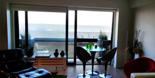 Ein Sitzbereich in der Unterkunft Superbe appartement digue vue mer