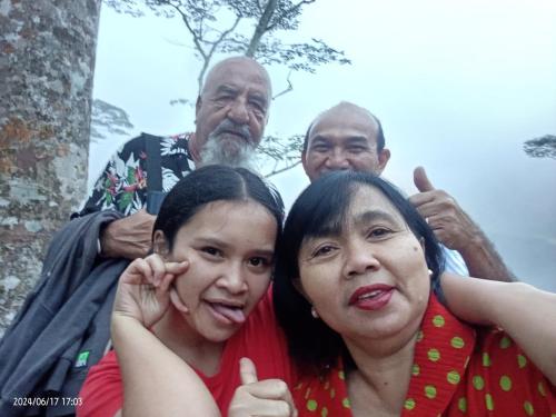 a group of people posing for a picture at Petra Homestay Bangka Leda in Ruteng