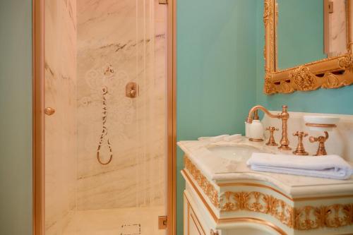 a bathroom with a sink and a shower at Maison des Barons in Nice