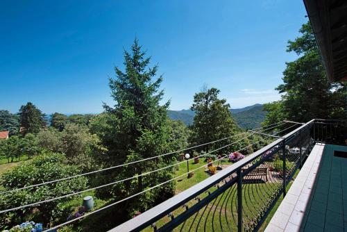 a balcony of a house with a view of the mountains at Ai campi in Stella
