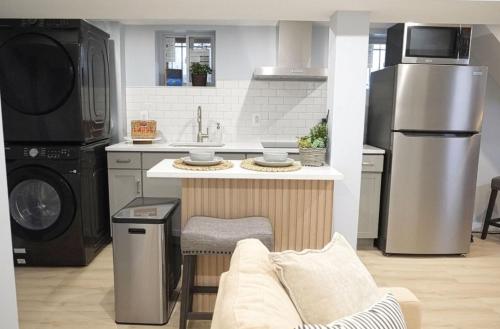 a kitchen with a couch and a sink and a stove at One bedroom apartment with AC and WiFi in the Bronx in Williams Bridge