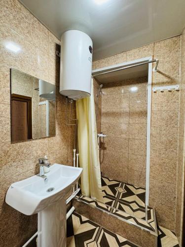 a bathroom with a sink and a shower at Sanahin Old&New in Alaverdi