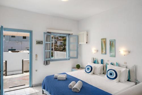 Postel nebo postele na pokoji v ubytování Pico Bello Patmos 10