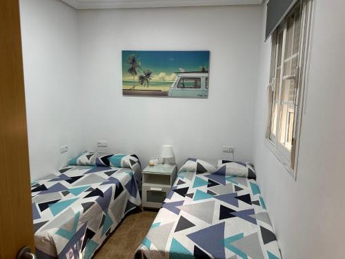 Casa Ciudad Jardín房間的床