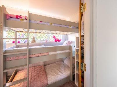 a small room with a bunk bed in a room at mulberry house in Flordon