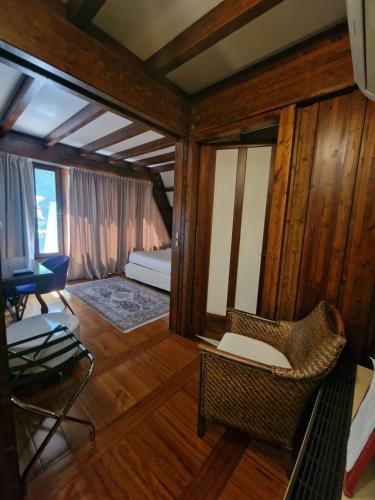 a room with a chair and a bed and a table at B&B Villa Sbaraglia in Alatri