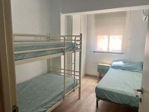 Katil atau katil-katil dalam bilik di Apartamento en Cullera