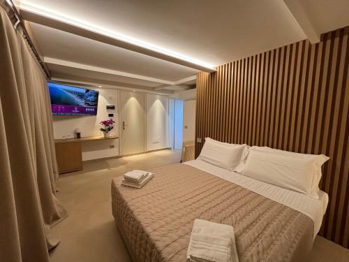 Postel nebo postele na pokoji v ubytování Hotel Orchidea
