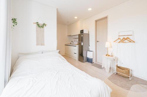 Ένα ή περισσότερα κρεβάτια σε δωμάτιο στο 포니제주 커플룸 105